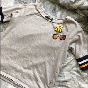 Steve Madden T shirt with designs on top